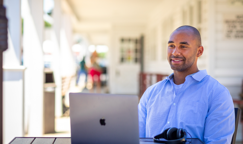 Man Sitting in Front of Laptop