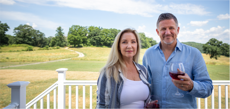 Couple Enjoying Wine on Home Deck