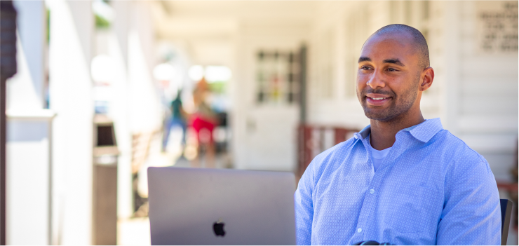 Man Sitting in Front of Laptop