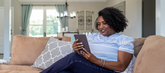 Woman Banking on Couch