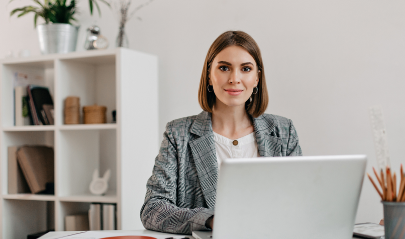 Business Woman sitting at desk with laptop