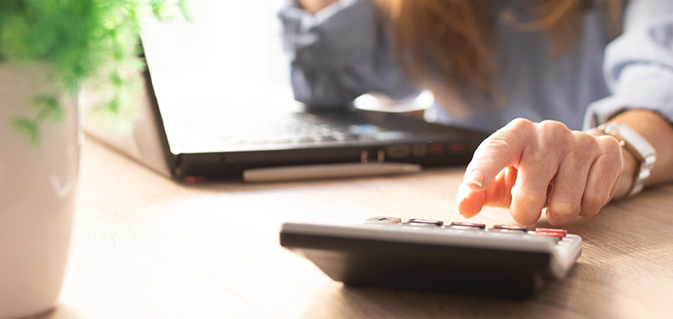 Woman Using Calculator