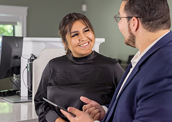 Banker and Woman Talking in a GSB Branch