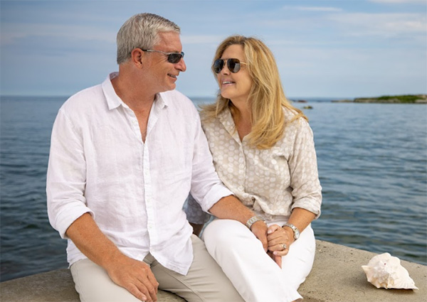 Couple Sitting by Ocean