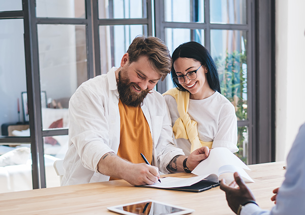 Couple signing a contract
