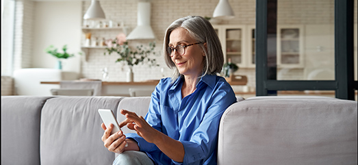 Woman using her phone at home