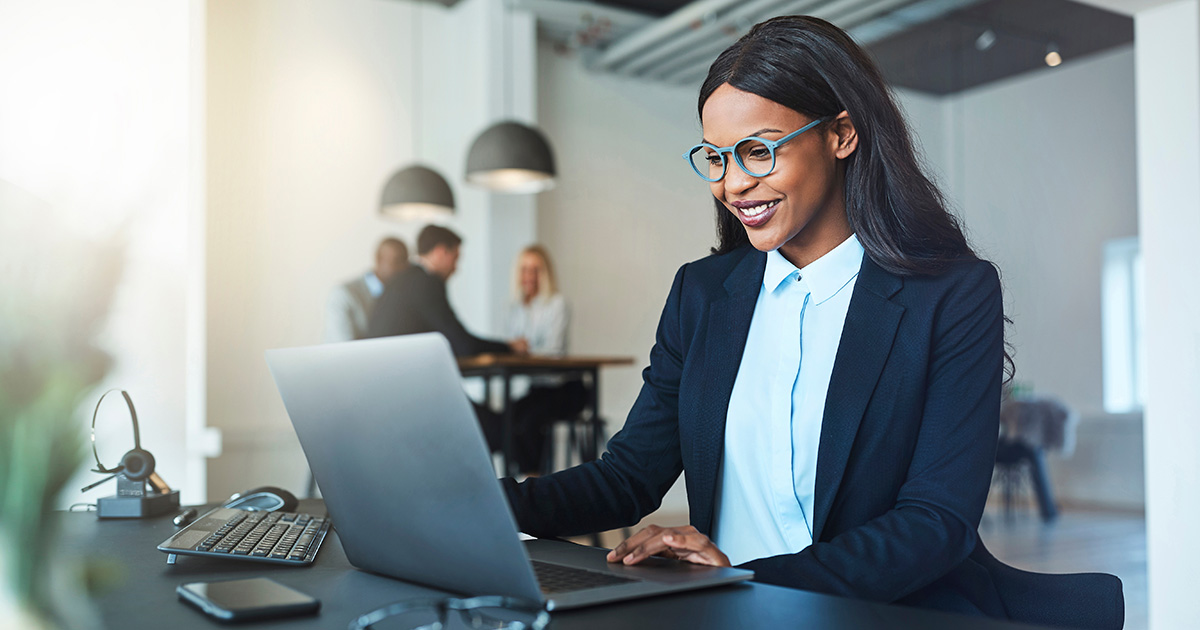 Businesswoman working on laptop in office