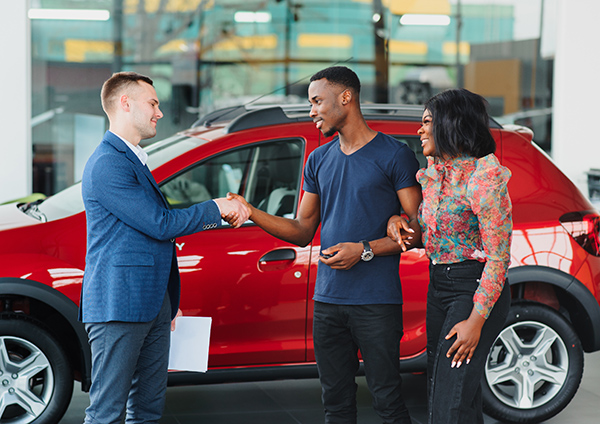 Couple purchasing a new car