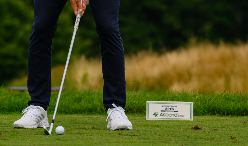 Close up of golfer lining up swing